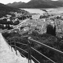 High angle view of townscape by sea