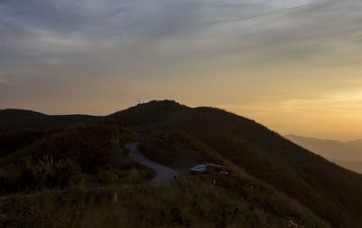 Scenic view of mountains against sky during sunset