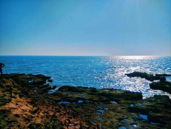 Scenic view of sea against clear blue sky