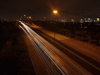 High angle view of light trails on road at night