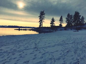 Scenic view of snow covered landscape against sky