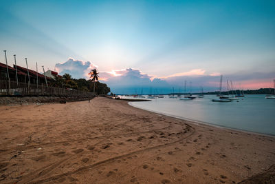 Scenic view of beach against sky during sunset