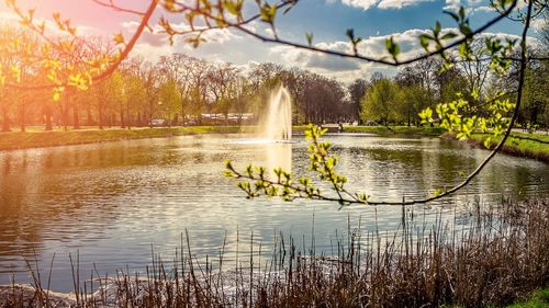 Scenic view of lake against sky at sunset