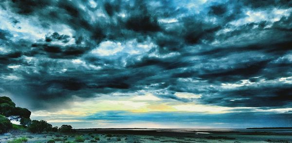 Scenic view of sea against cloudy sky