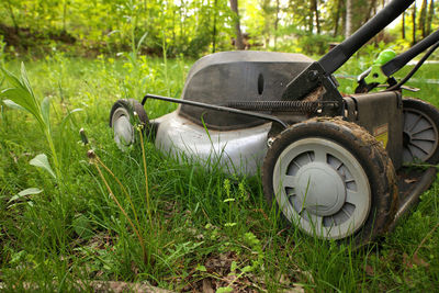 Close-up of car on grassy field