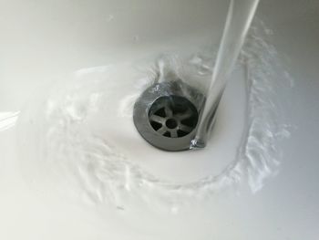 Close-up of water splashing in bathroom