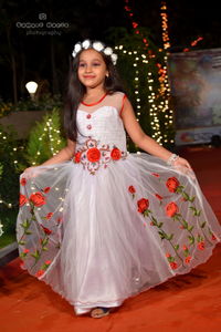 Portrait of smiling girl standing at home