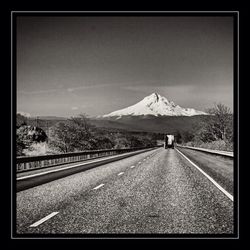 Country road leading towards mountains