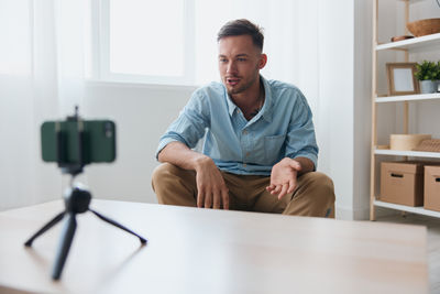 Portrait of young man working at home