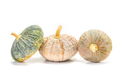 Close-up of pumpkins against white background