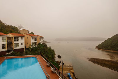 Scenic view of sea with mountain in background