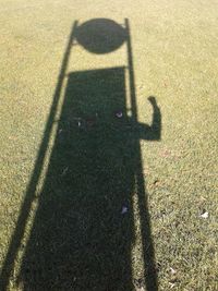 Shadow of people on road