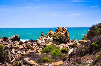 Scenic view of sea against blue sky