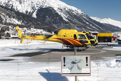 A rescue helicopter in the mountains in st moritz
