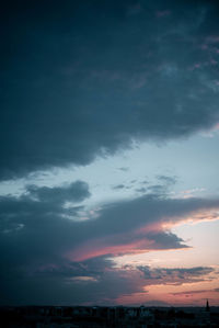 Low angle view of dramatic sky during sunset