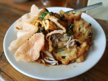 Close-up of mushrooms in plate on table