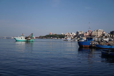 Fishing boats moored in the harbour of the italian city taranto