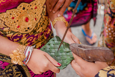 Close-up of woman holding hands