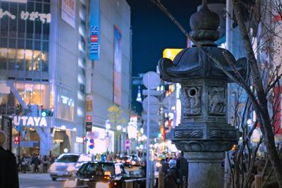 City street amidst buildings at night