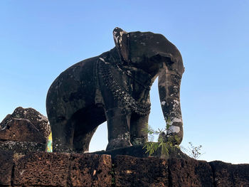 Ancient khmer architecture elephant statues at sunrise, angkor wat, siem reap, cambodia