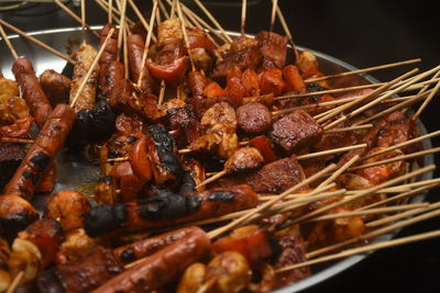 Close-up of grilled sausages, chicken dumplings and paprika.