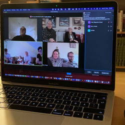 Group of people using laptop on table