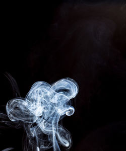 Close-up of smoke against black background