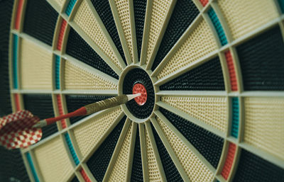 Close-up of dart on dartboard