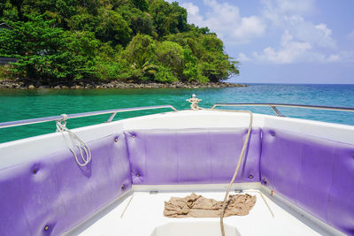 Boat sailing in swimming pool by sea against sky