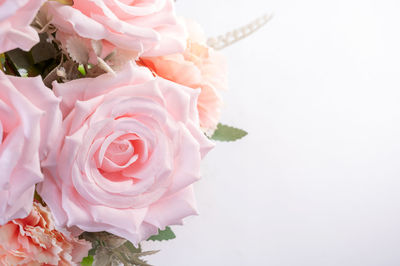 Close-up of rose bouquet against white background