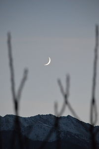 Scenic view of silhouette mountain against sky at dusk