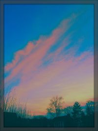 Low angle view of silhouette trees against sky during sunset