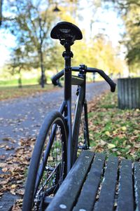 Close-up of bicycle wheel during autumn