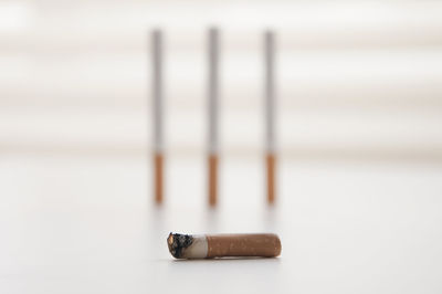 Close-up of cigarette on table