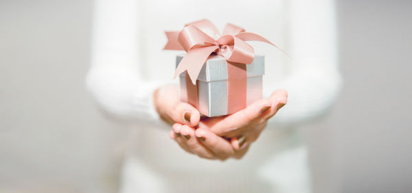 Midsection of woman holding gift box