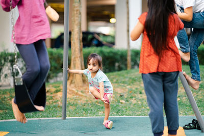 Siblings playing at playground