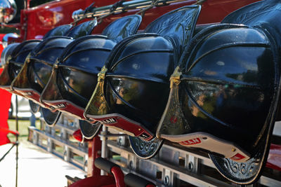 Close-up of helmets at shop for sale