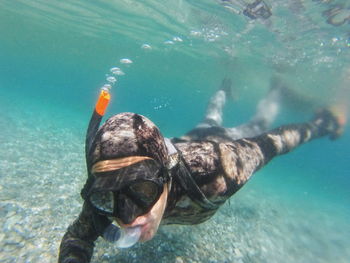 Person snorkeling in sea