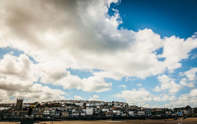 Townscape against cloudy sky