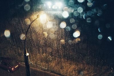 Reflection of illuminated street lights in water at night