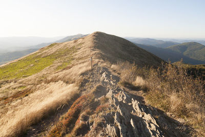 Aerial view of mountain range against clear sky