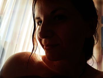 Close-up portrait of young woman looking away