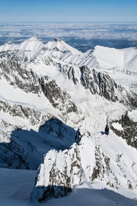 Scenic view of snowcapped mountains against sky. view from lomnica, tatra mountains, poland