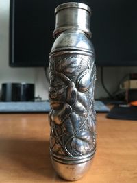 Close-up of glass vase on table at home