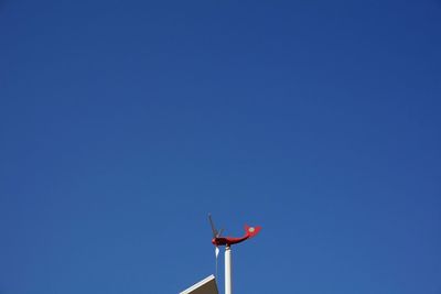 Low angle view of tree against clear blue sky