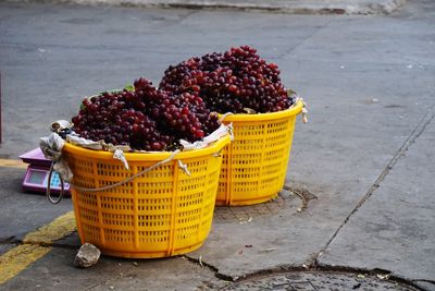 Close-up of fruits in basket on street
