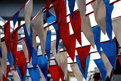 Low angle view of flags against sky