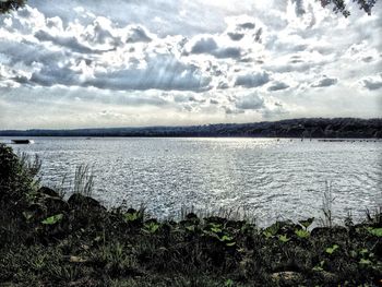 Scenic view of sea against cloudy sky