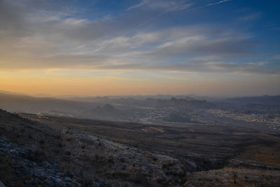 Scenic view of landscape against sky during sunset