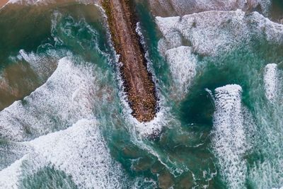 Aerial view of groyne in sea